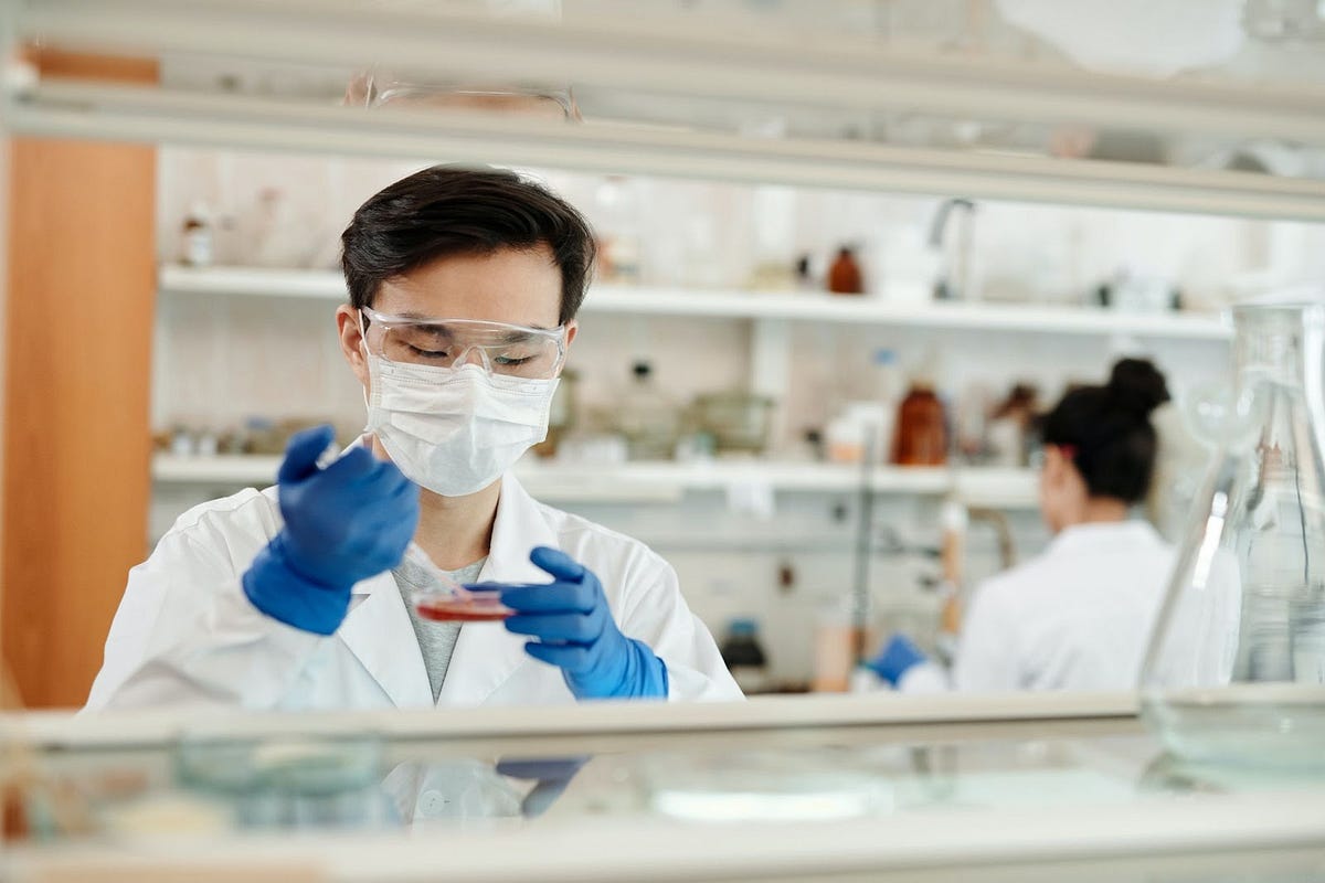 a scientist working on a petri dish