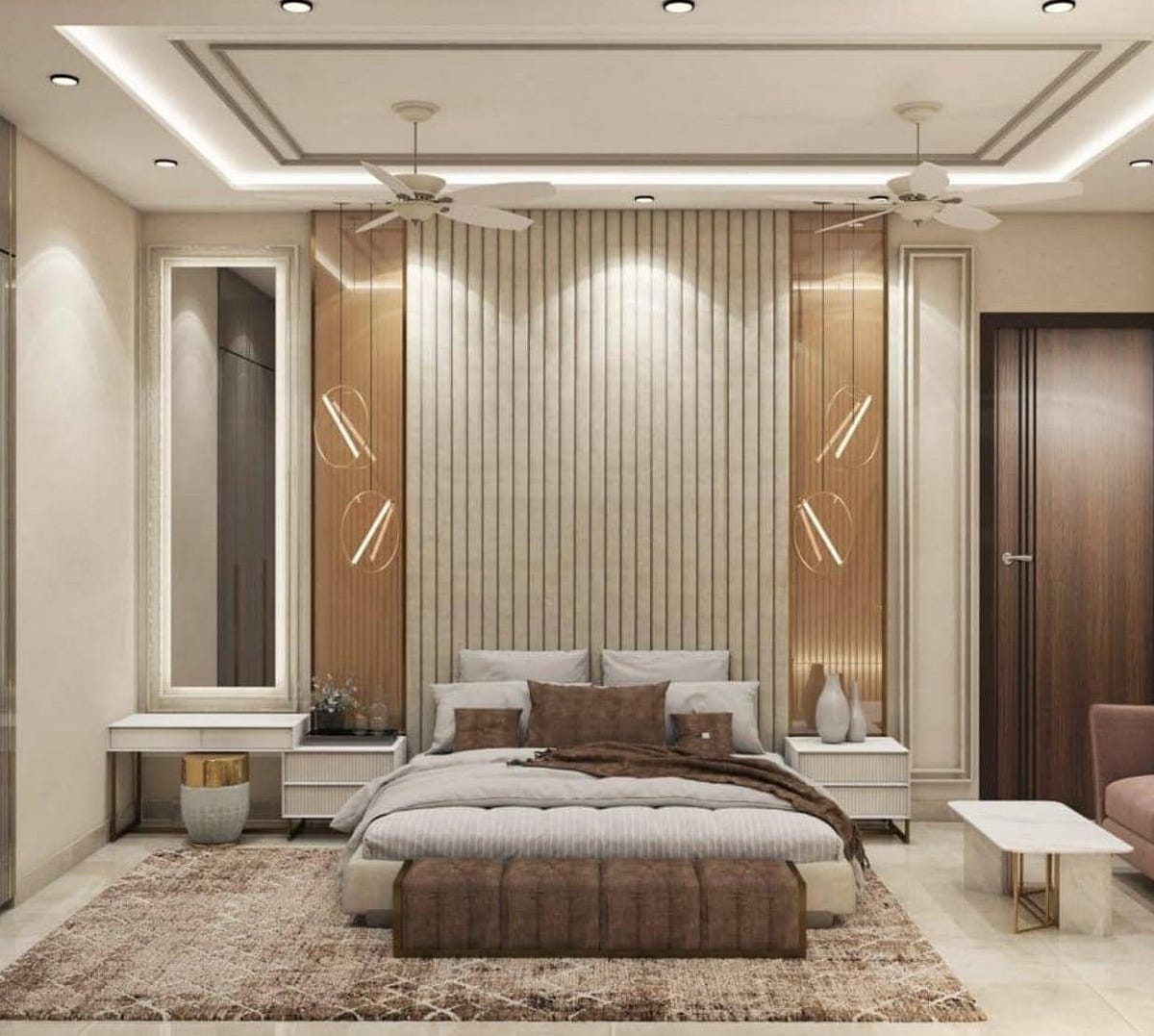 This master bedroom exudes luxury with its modern wall paneling, warm ambient lighting, and sophisticated color palette. The upholstered bed with layered bedding creates comfort, while sleek side tables and decorative pendant lights add style. The false ceiling with recessed lights enhances spaciousness, and the textured rug ties the room together. Designed with elegance and functionality, this bedroom blends modern aesthetics with cozy appeal for a restful retreat.