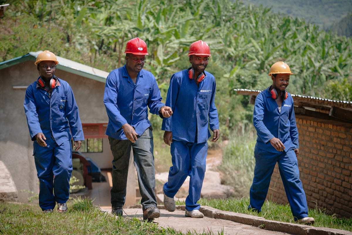 Amahoro Energy employees at work at one of the company’s hydropower facilities in rural Rwanda. / Matt Chenet for Power Africa 