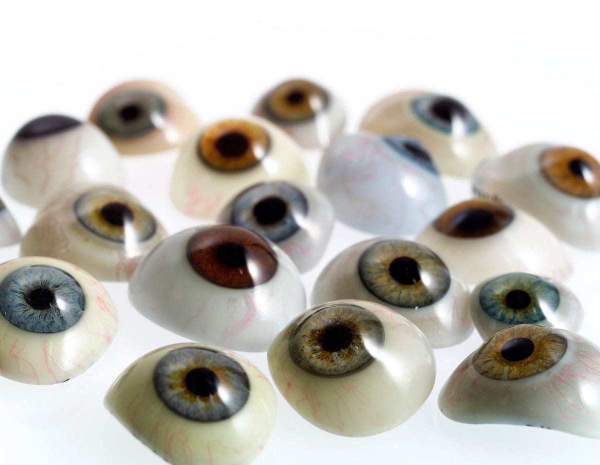 A bunch of glass eyes of varying eye colors