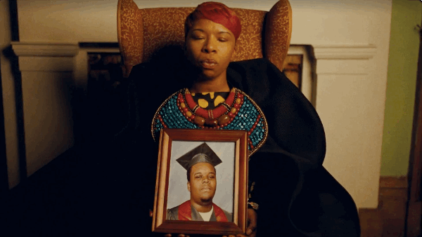 Lesley McSpadden holding a picture of her late son, Mike Brown.