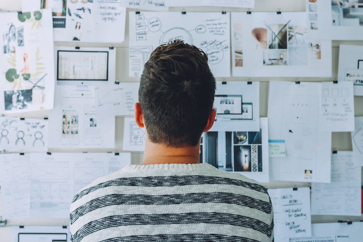 Photo by [Startup Stock
Photos](https://www.pexels.com/photo/man-wearing-black-and-white-stripe-shirt-looking-at-white-printer-papers-on-the-wall-212286/)
from Pexels