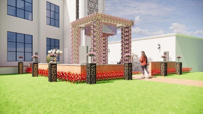 Daytime view of a vibrant floral canopy entrance at DP Palace in Delhi, surrounded by manicured lawns and elegant decor accents. The design showcases the creative expertise of the Best Interior Designer in Delhi, with a balance of color, symmetry, and functional pathways. A fine example of how an Interior Designer in Delhi brings grace and charm to outdoor event spaces with thoughtful detailing.
