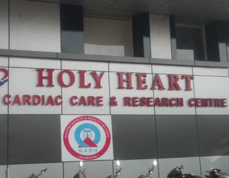 Holy Heart Cardiac Care & Research Centre showcases a functional and elegant hospital façade, reflecting expert planning by architectshive. This healthcare design is a benchmark project by BestInteriorDesignersInRohtak, offering efficient and modern InteriorDesignInRohtak with patient-centric detailing. The use of clean materials and branding aligns with top-tier InteriorDesignerInRohtak standards.