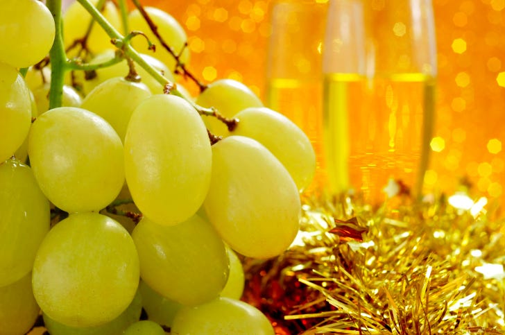 In Spanish Homes Families And Groups Of Friends Eat 12 G S One By One At The Stroke Of Midnight As The Bells Toll In The Clock Tower Of The Puerta Del In Spanish Homes Families And Groups Of Friends Eat 12 G S One By One At The Stroke Of Midnight As The Bells Toll In The Clock Tower Of The Puerta Del
