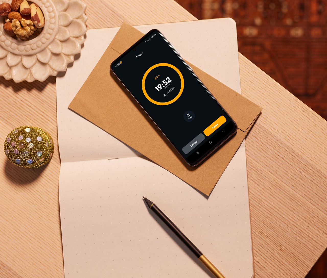 Phone displaying Ultra Alarm’s timer feature set for 20 minutes, placed on a cozy desk setup with a notebook and snacks. Perfect for staying productive or timing a quick break during a busy day.