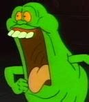 A screen-capture from The Real Ghostbusters showing Slimer, excited, with his mouth open and his eyes boggling.