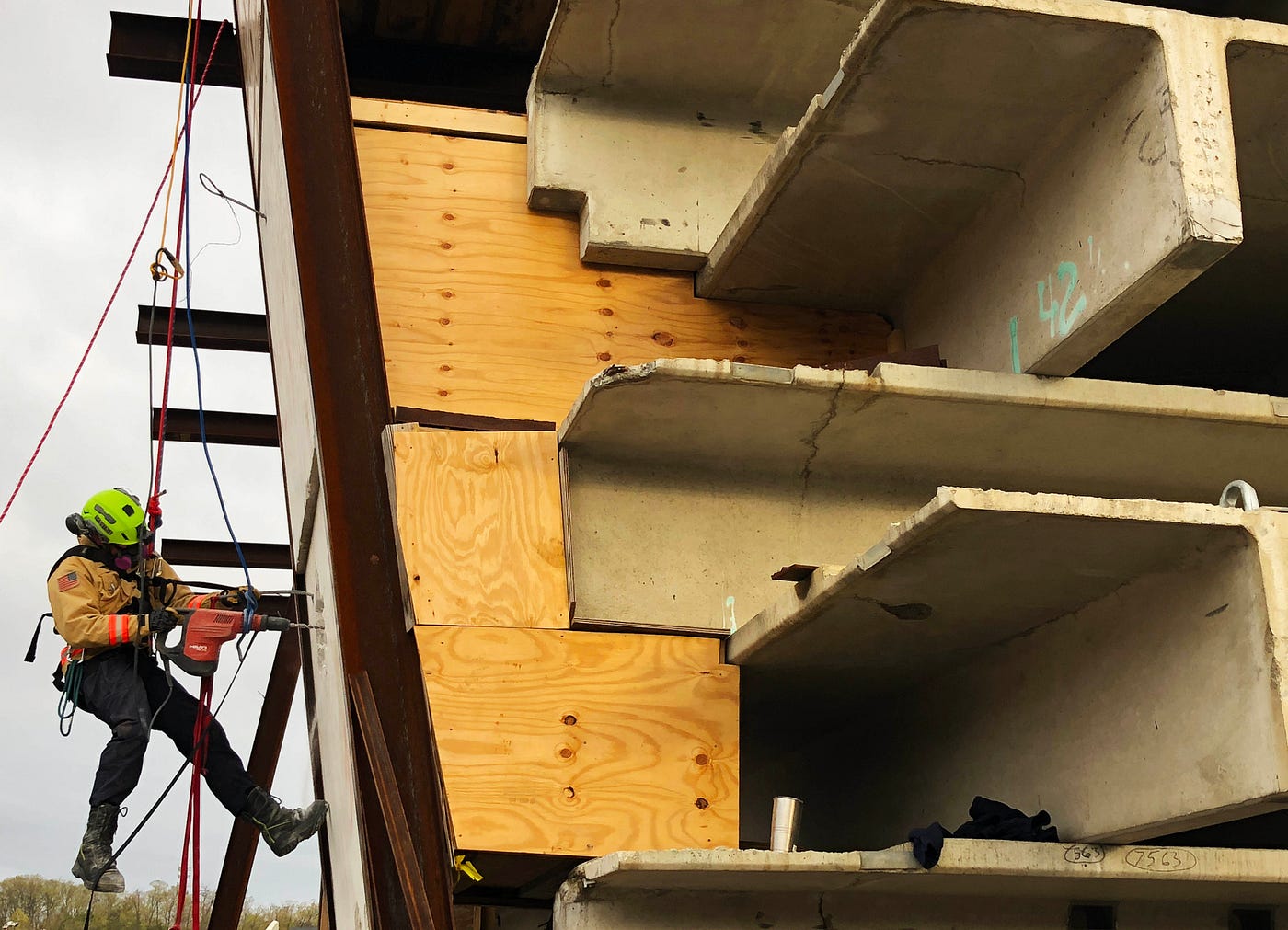 During rescues, time is a critical factor and can mean the difference between life and death. That’s why urban search and rescue teams work around the clock in rotating shifts. Here, a member of Fairfax County Fire and Rescue is suspended by ropes as he drills through concrete.