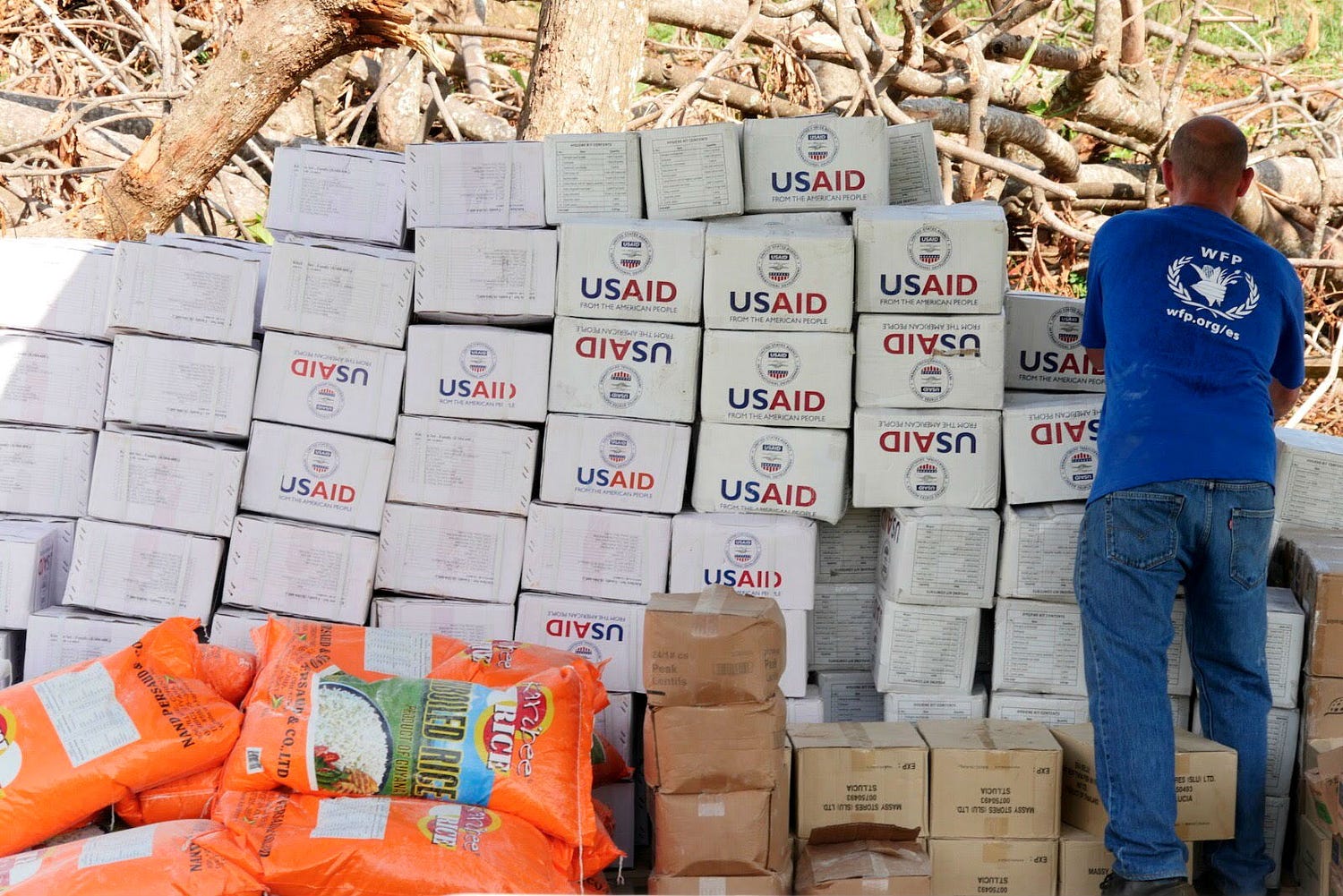 The UN World Food Program (WFP) prepares to distribute USAID-provided humanitarian assistance. / Francesca Ciardi, WFP