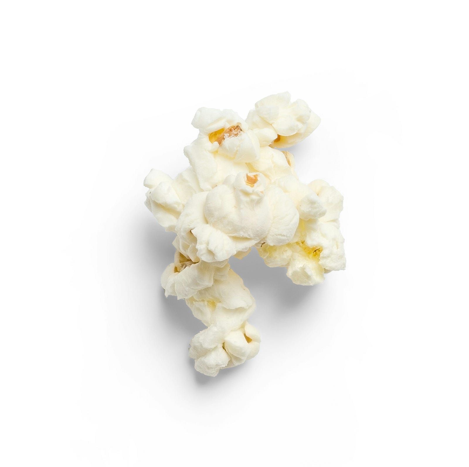 A single piece of popcorn. Popcorn is sometimes ultraprocessed.