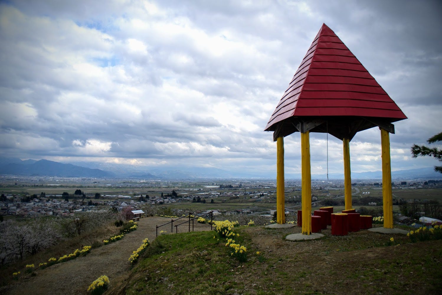 The hut at the summit of Mt. Kitayama with its distinctive red roof, and view of inland Yamagata Prefecture.
