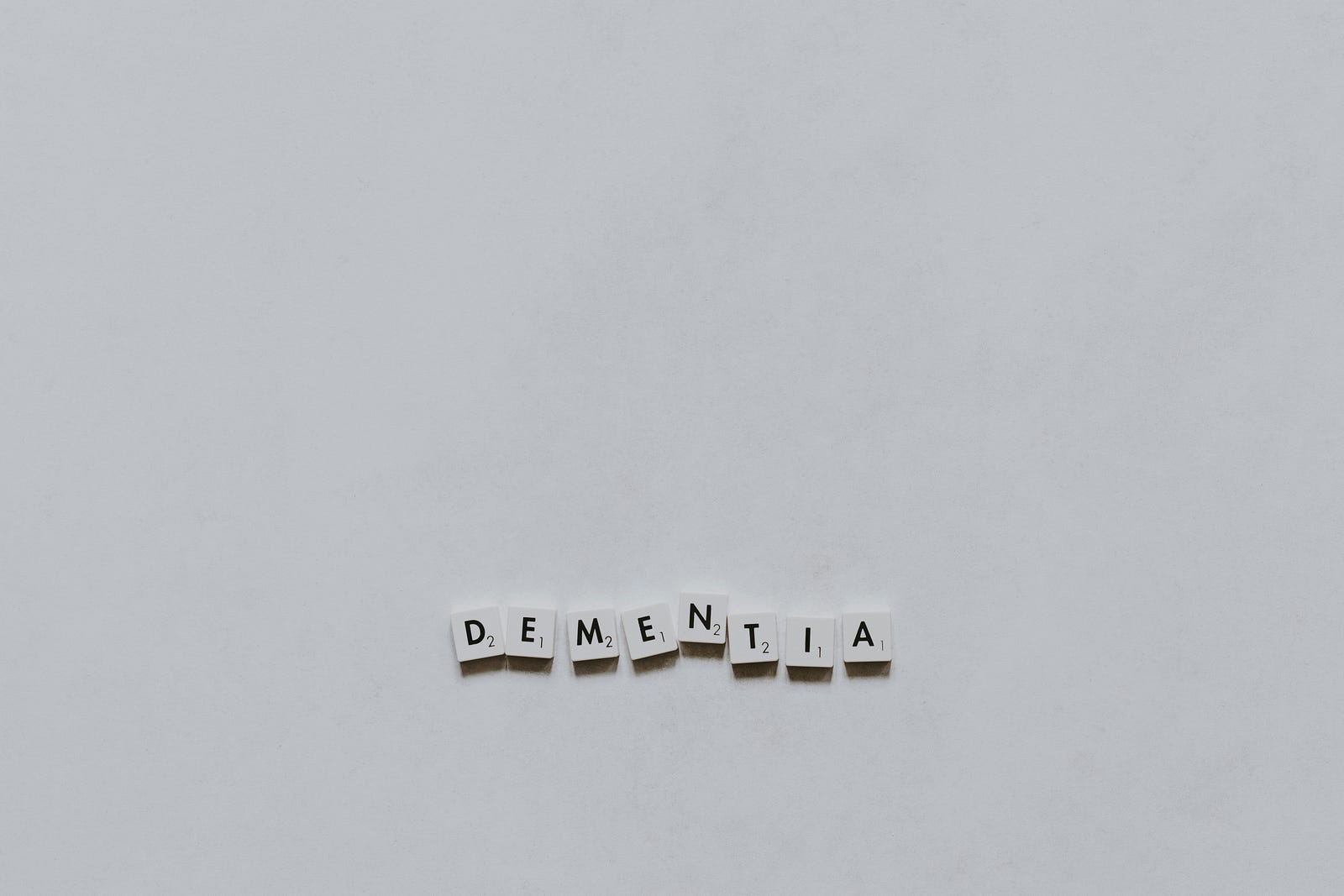 DEMENTIA, spelled out in Scrabble tiles.