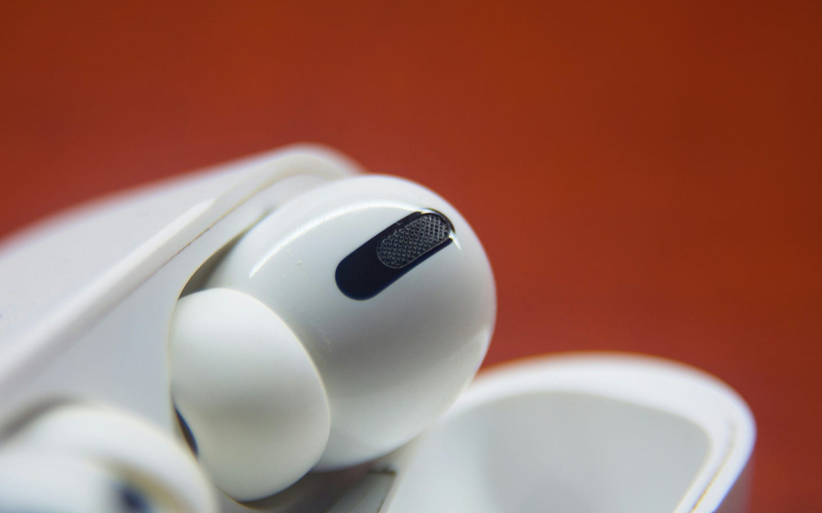 Apple AirPod Pro devices in a white case.