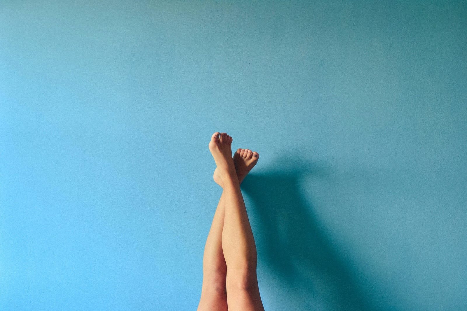 Knees and lower legs extend upward from the bottom of the image. Strength training helps prevent arthritis.