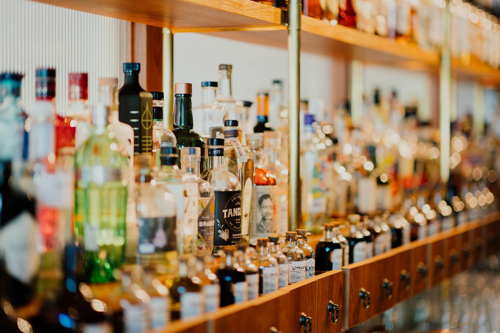 Dozens of bottles of alcohol are set in a row on the left. My takeaway messages are simple: I try to reduce my cancer risk by limiting my consumption of sugar-sweetened drinks. I avoid excessive alcohol consumption. I don’t drink, but if I did, I would cap it at one (if I were a woman) or two standard drinks daily.