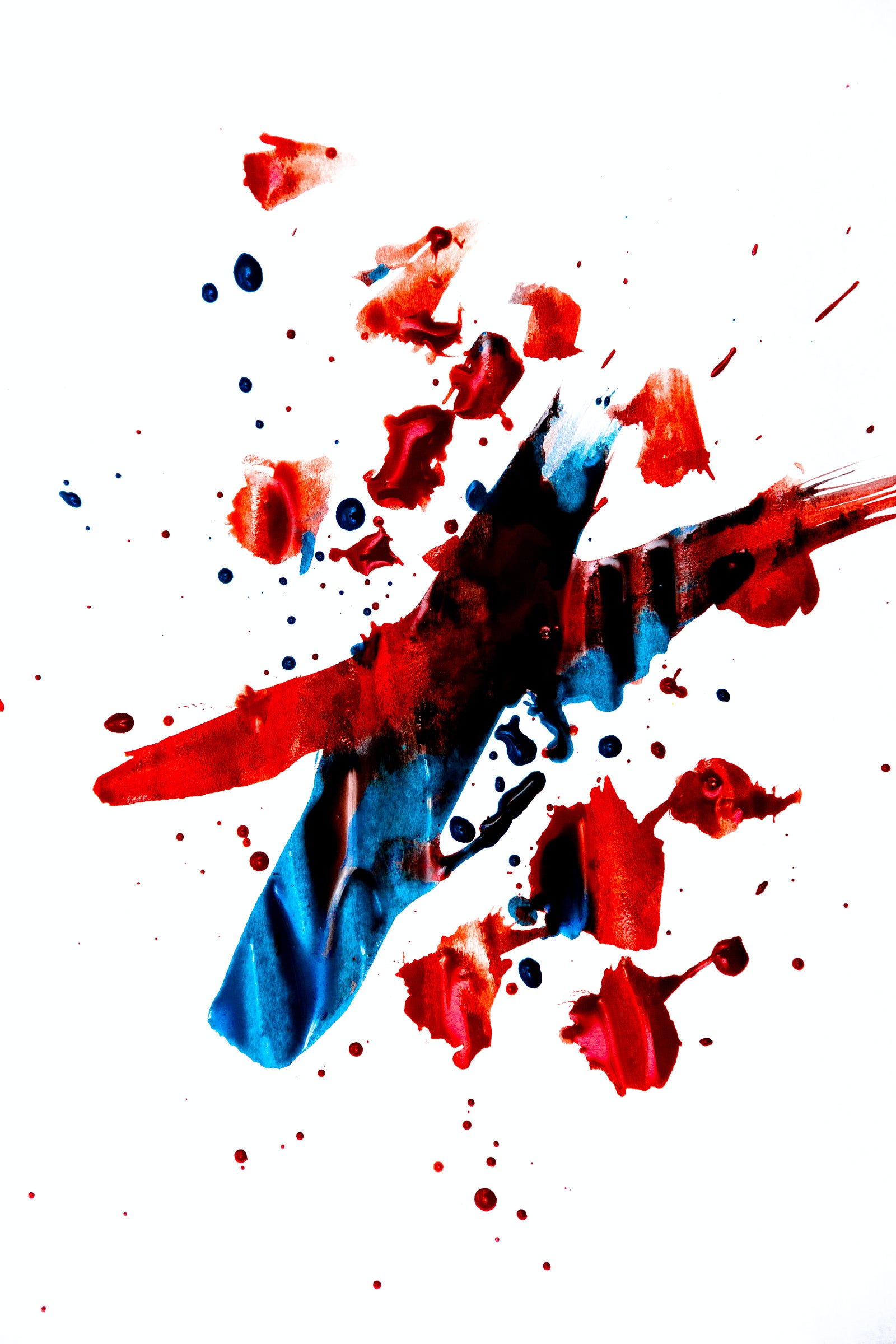 Splashes of red and blue ink, across a white background. People can react differently to the same cancer treatment, so it’s crucial to find markers to tell us which treatment will work best for each individual.
