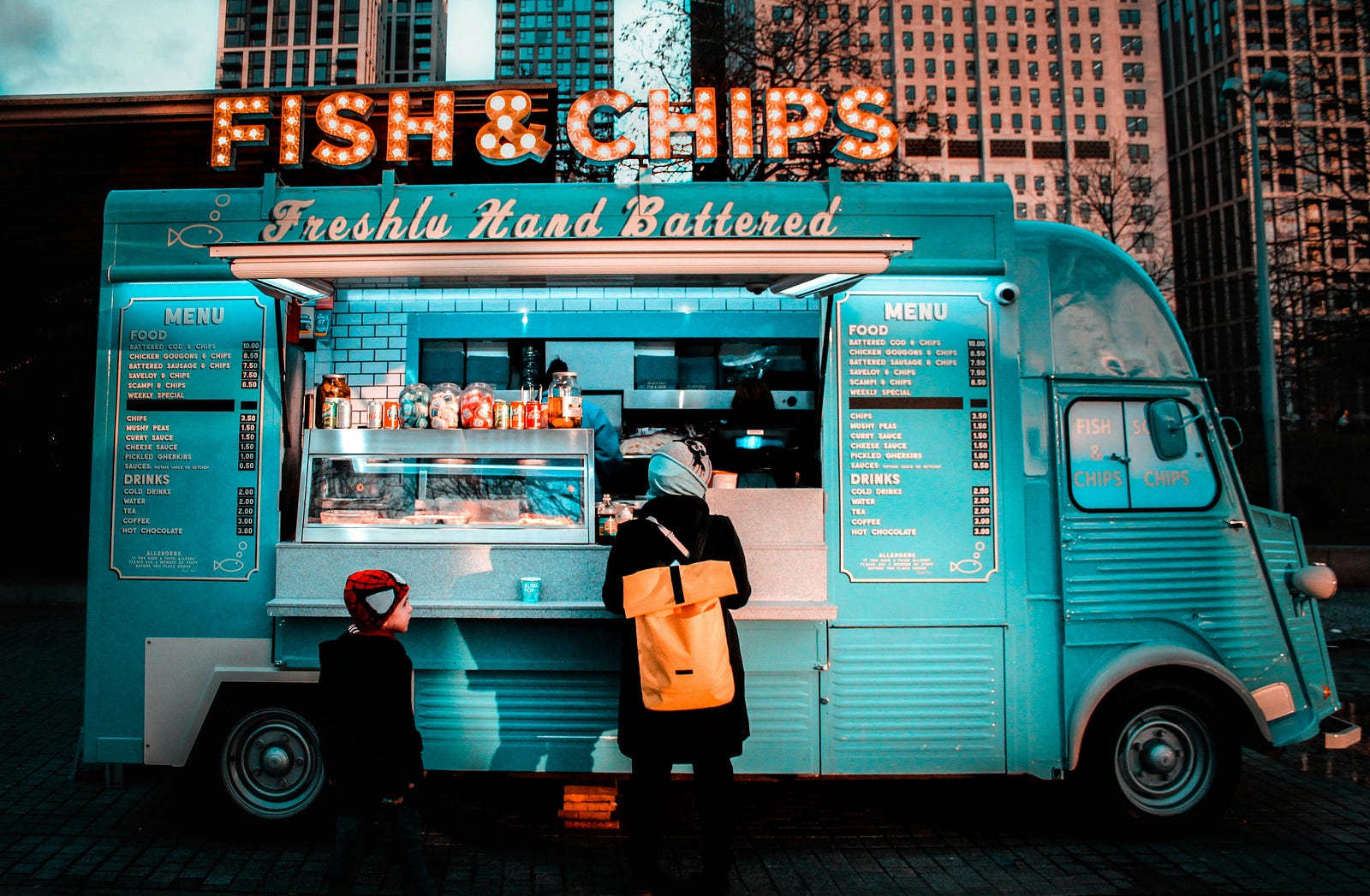 A fish and chips blue-colored food truck.