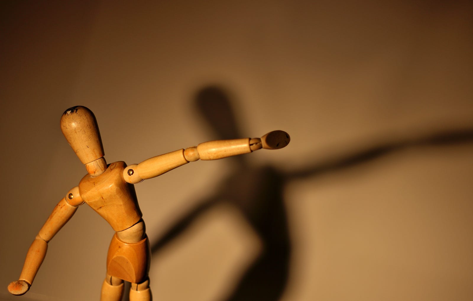 A wooden stick figure appears to dance in the left foreground. Its shadow is seen on a wall in the distance. One of the ways music affects the heart is through its rhythmic properties. Our hearts have a natural rhythm known as the heartbeat, controlled by electrical impulses.