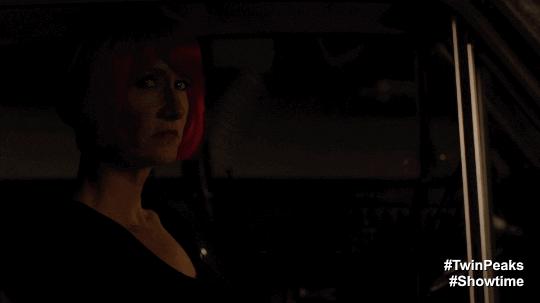 Diane sees possible tulpa of self at hotel with neon signage animated GIF