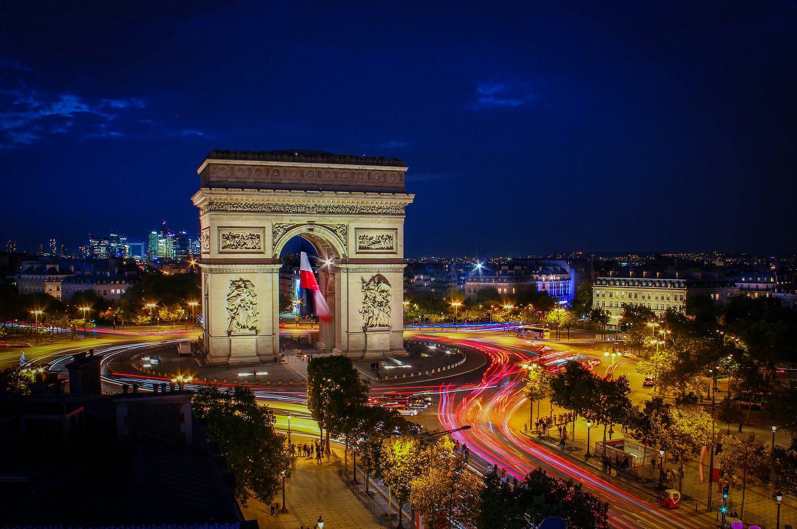 A night view of the Arch de Triomph in Paris, France.