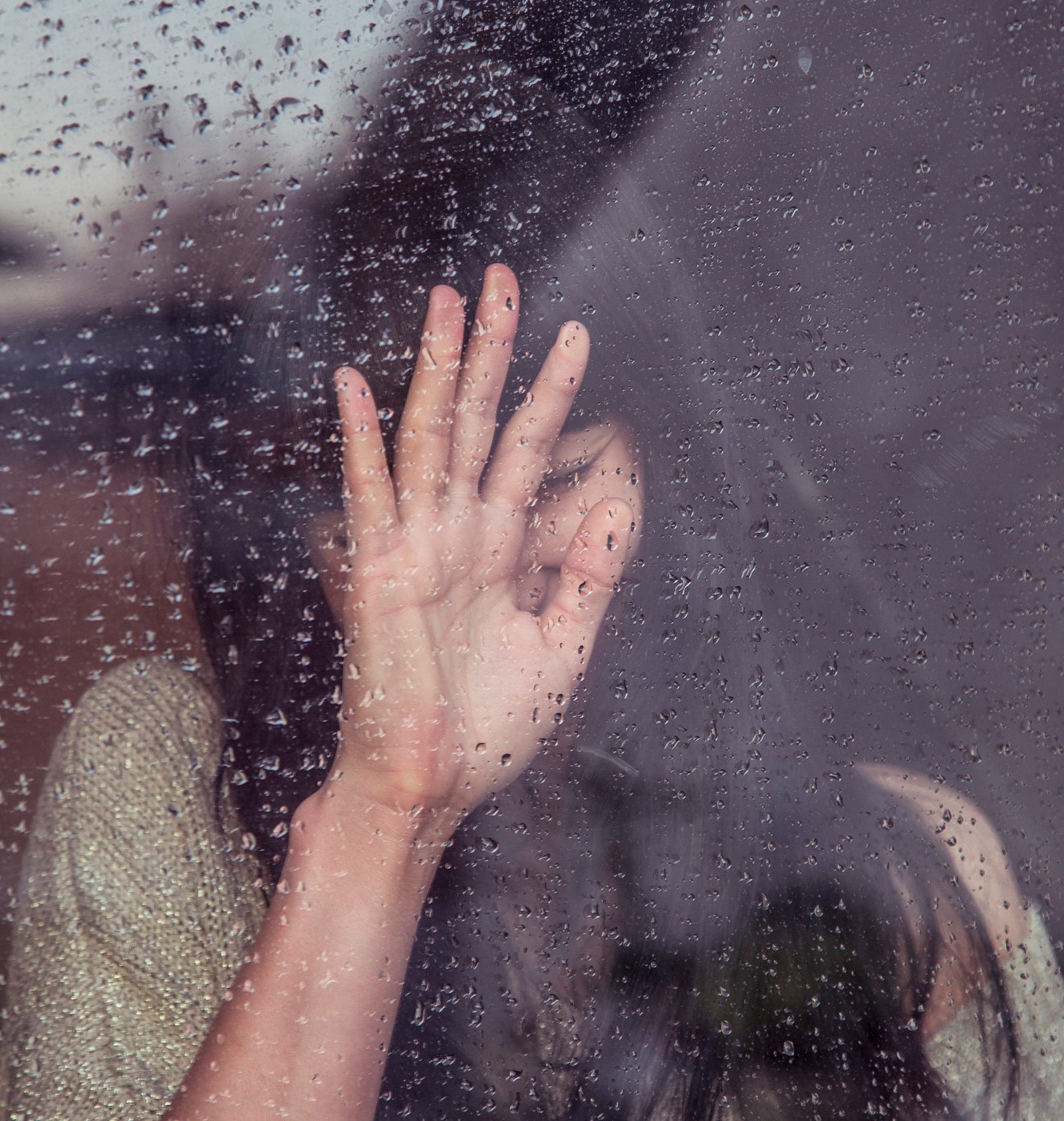 A woman puts her hand against a rain-streaked window. Colonoscopy prep can present several challenges for individuals undergoing the procedure. One of the primary challenges is the strict dietary restrictions and the need to consume a clear liquid diet for a specific period before the colonoscopy.