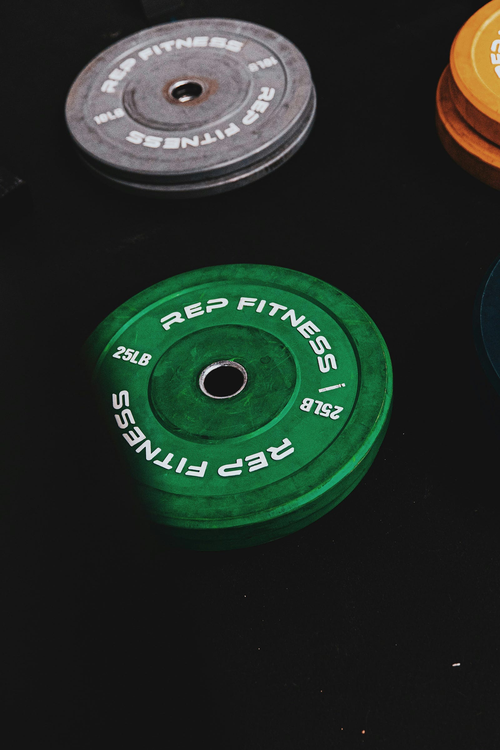 Barbell plates in various colors.