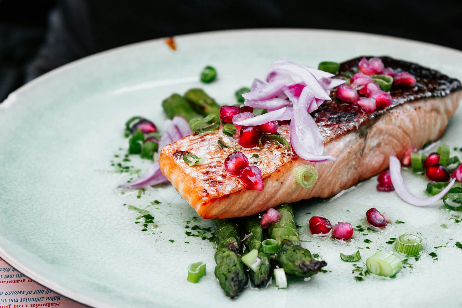 Salmon on a white plate. The dish is typical of an Atlantic diet.