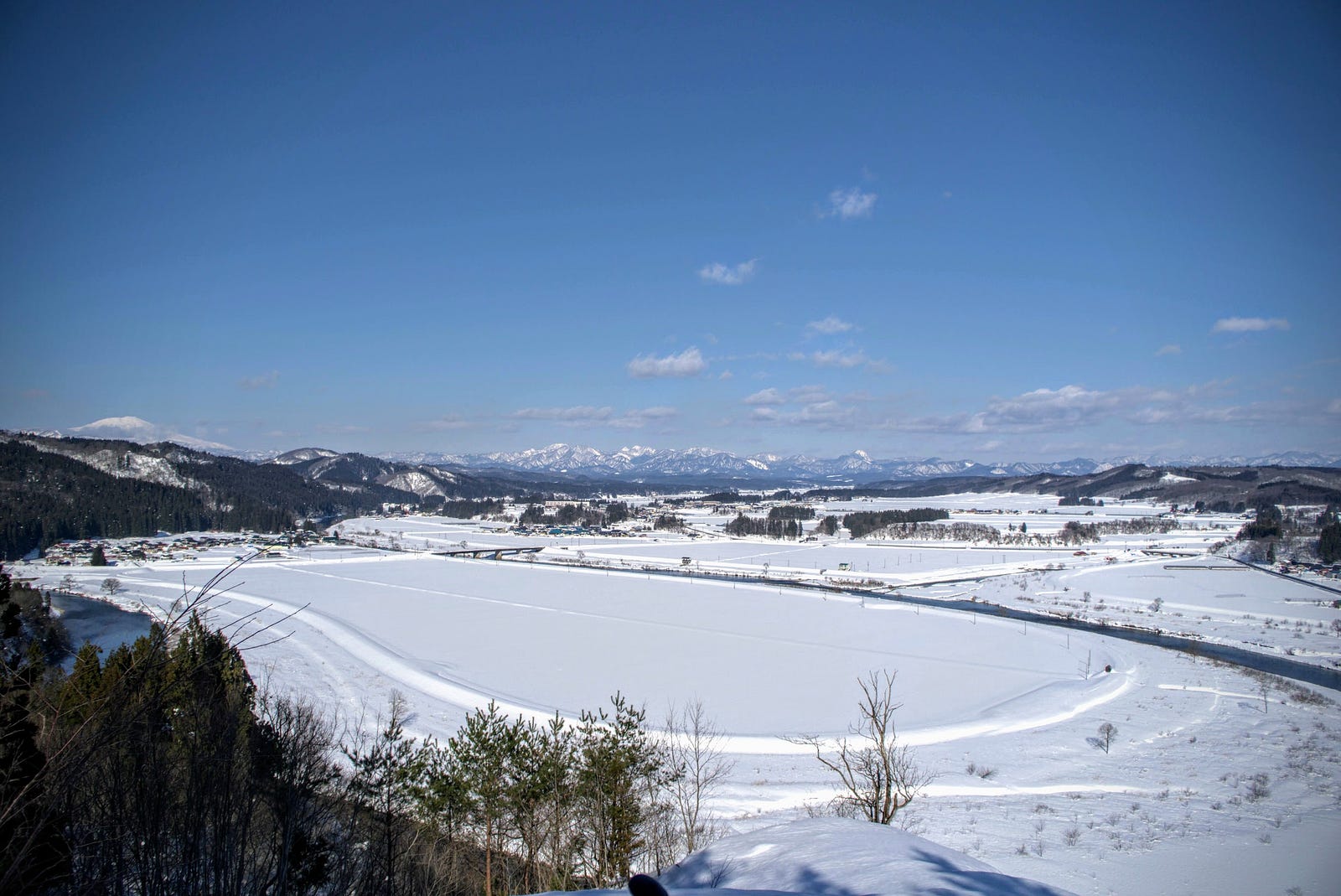 Mt. Chokai and Sakegawa Village covered in snow with the Sakegawa River cutting across