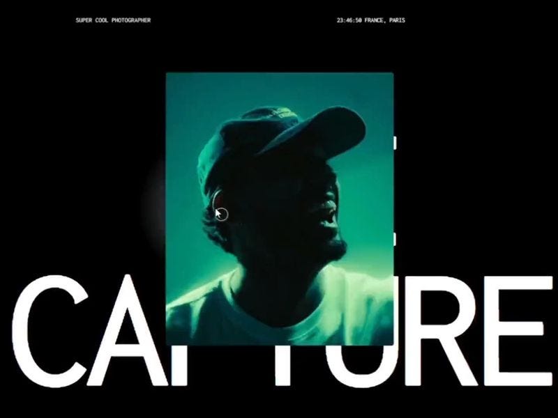 Dark photographer portfolio interface featuring a teal-lit portrait over large “CAPTURE” typography, with minimal UI elements and cinematic styling.