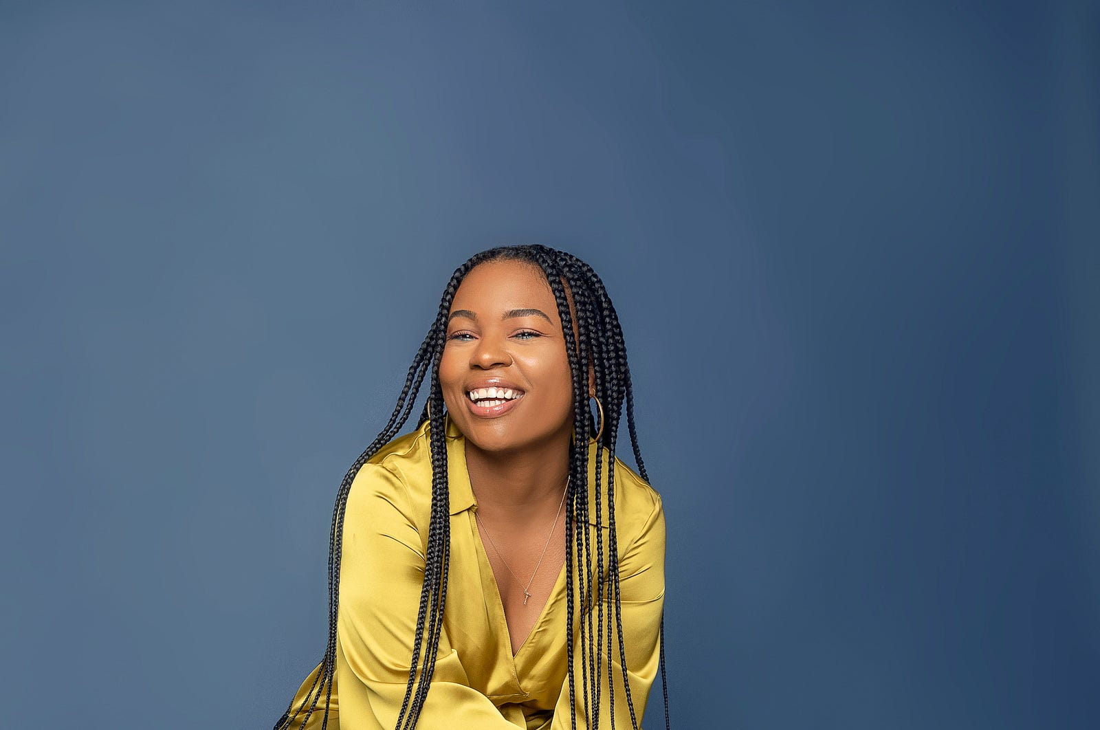 A young black woman smiles. Black women are 1.4 times more likely to die from breast cancer than whites, despite similar screening rates.