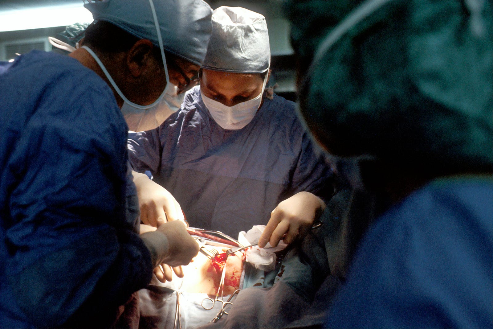 Surgeons operating.