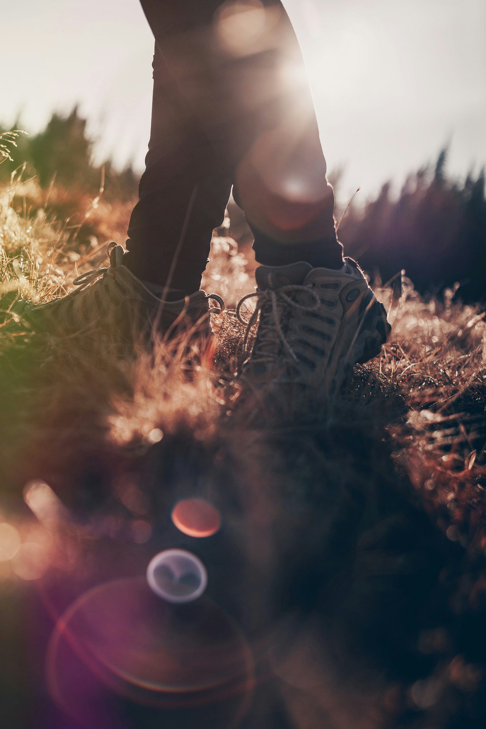 A person walks. We see their lower legs only. Movement can slow aging.