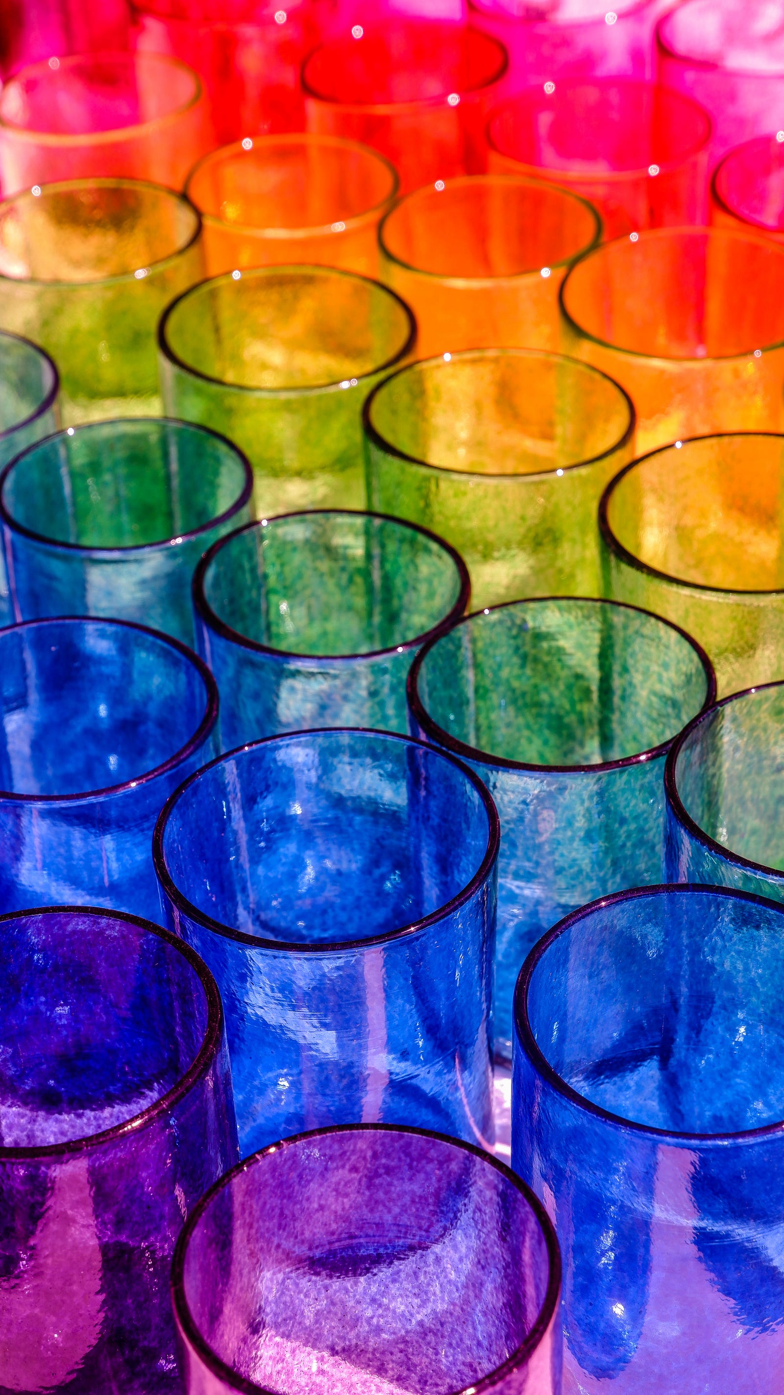 A photo of rows of very colorful test tubes. People who work in certain occupations, such as the dye, rubber, and leather industries, are at increased risk of developing bladder cancer.