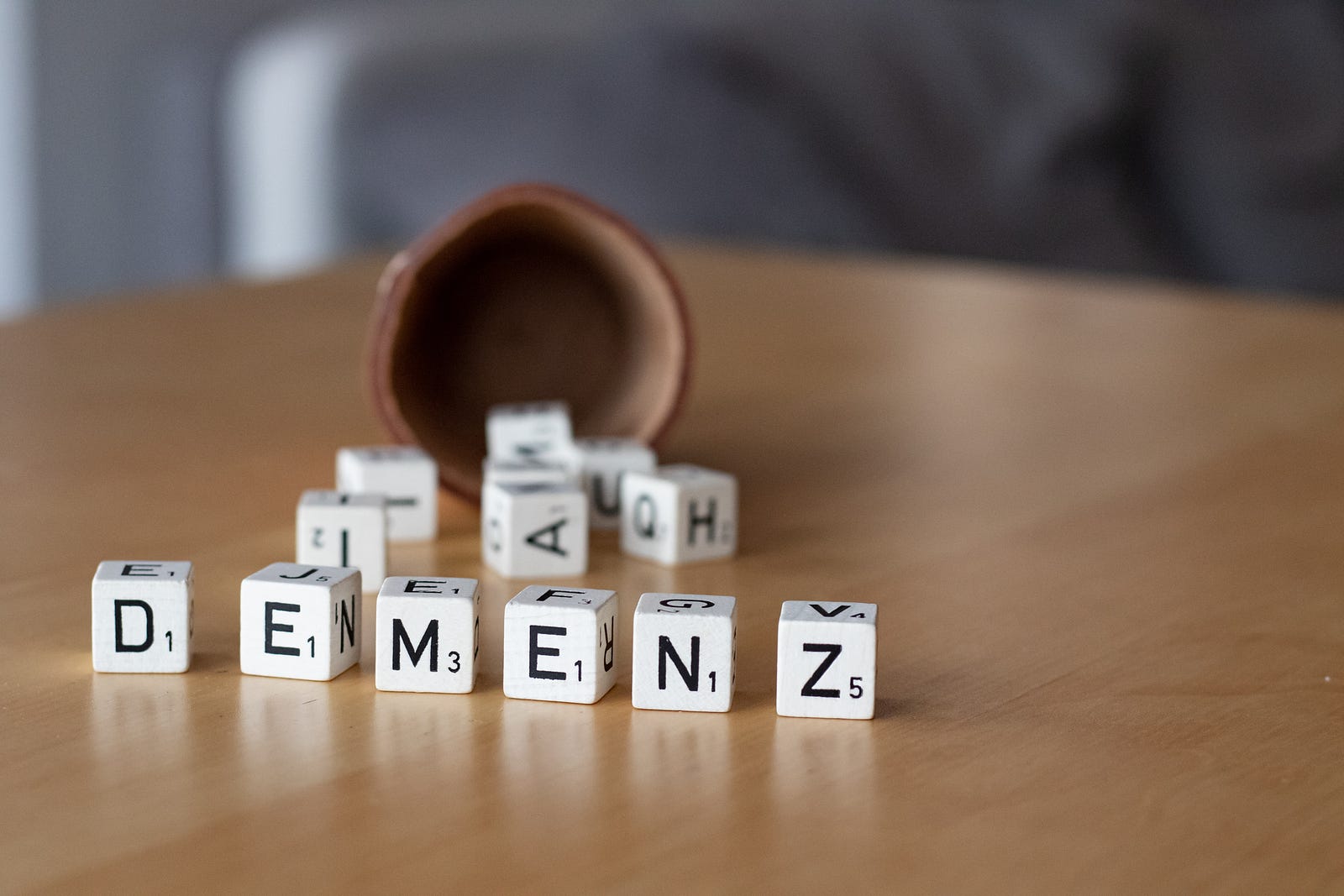 Dementia is misspelled as DEMENZ by scrabble tiles.