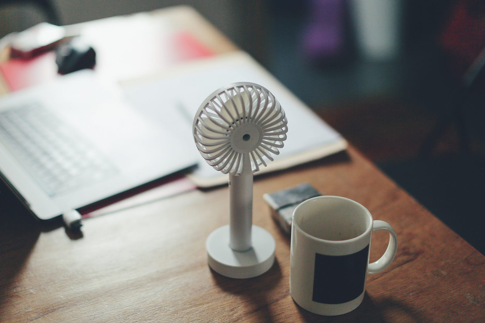 A tiny fan stands on a desk. Nearly 95 percent reported having had negative mood changes since entering the period around menopause. Of these, one in five received a diagnosis of a mood disorder or depression.