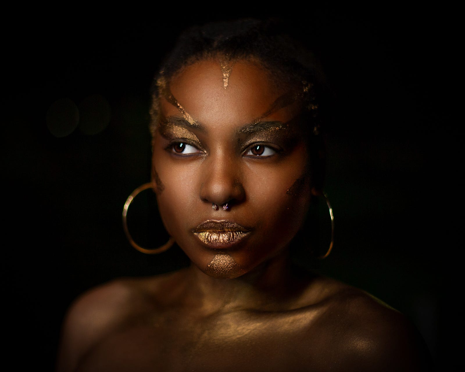 A young black woman in the dark faces us, highlighted by a light. The vast majority of the placebo-controlled studies showed that drinking cranberries as a juice or taking capsules reduced the number of UTIs in women with recurrent cases, children, and people susceptible to infections following medical interventions such as bladder radiotherapy. However, cranberry products did not reduce UTI risk for pregnant women, older adults, or those with bladder emptying problems.