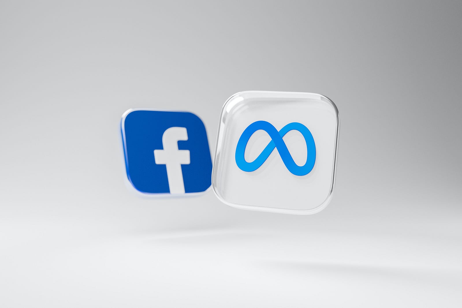 Two plastic, rectangular buttons show the Facebook and Meta logos, respectively. In our hyper-connected world, constant emails, messages, and social media updates can contribute to stress.
