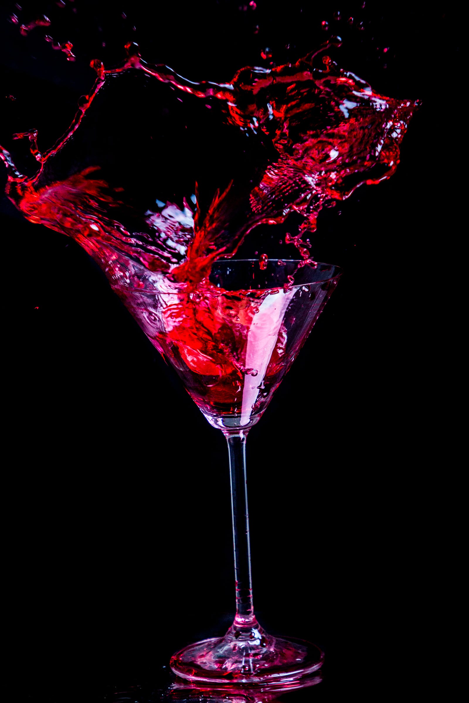 A cone-shaped glass with a stem has red fluid splashing upward. Heavy alcohol consumption has been consistently associated with an increased risk of cardiovascular diseases, including the following: High blood pressure (hypertension) Arrhythmias Coronary artery disease Cardiomyopathy Heart attack Stroke