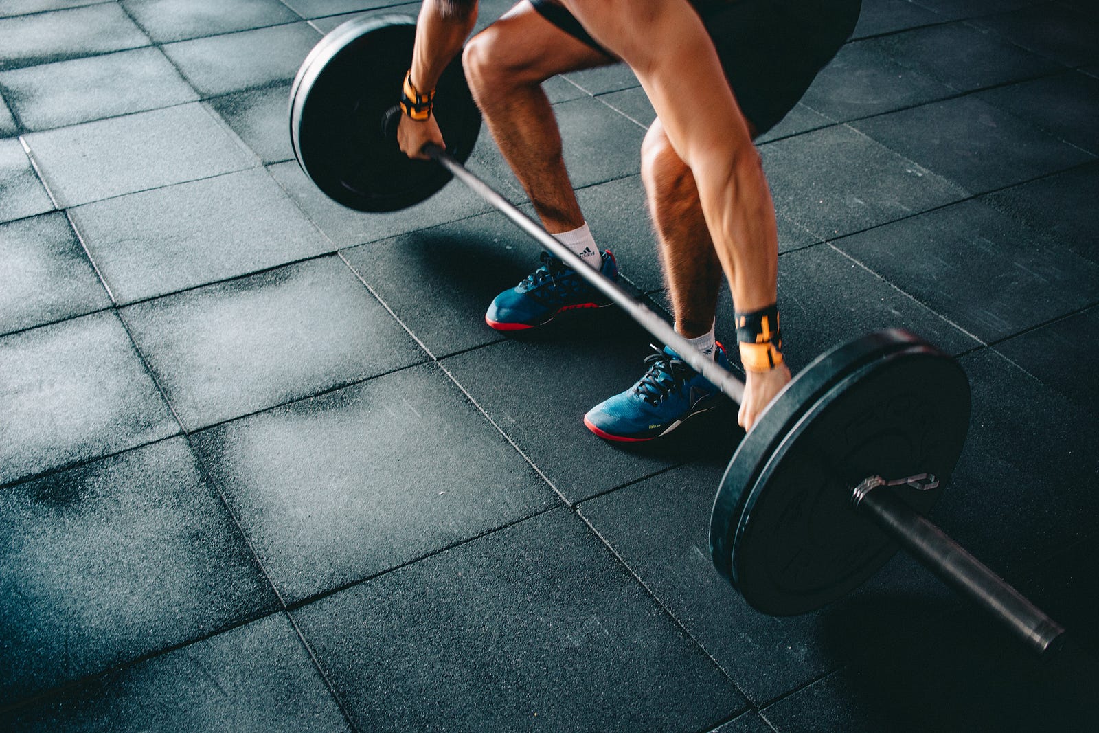 A person bends down to lift a barbell. An older study showed that a single 30-minute weightlifting session increased testosterone levels by 22 percent in men but only 17 percent in women.