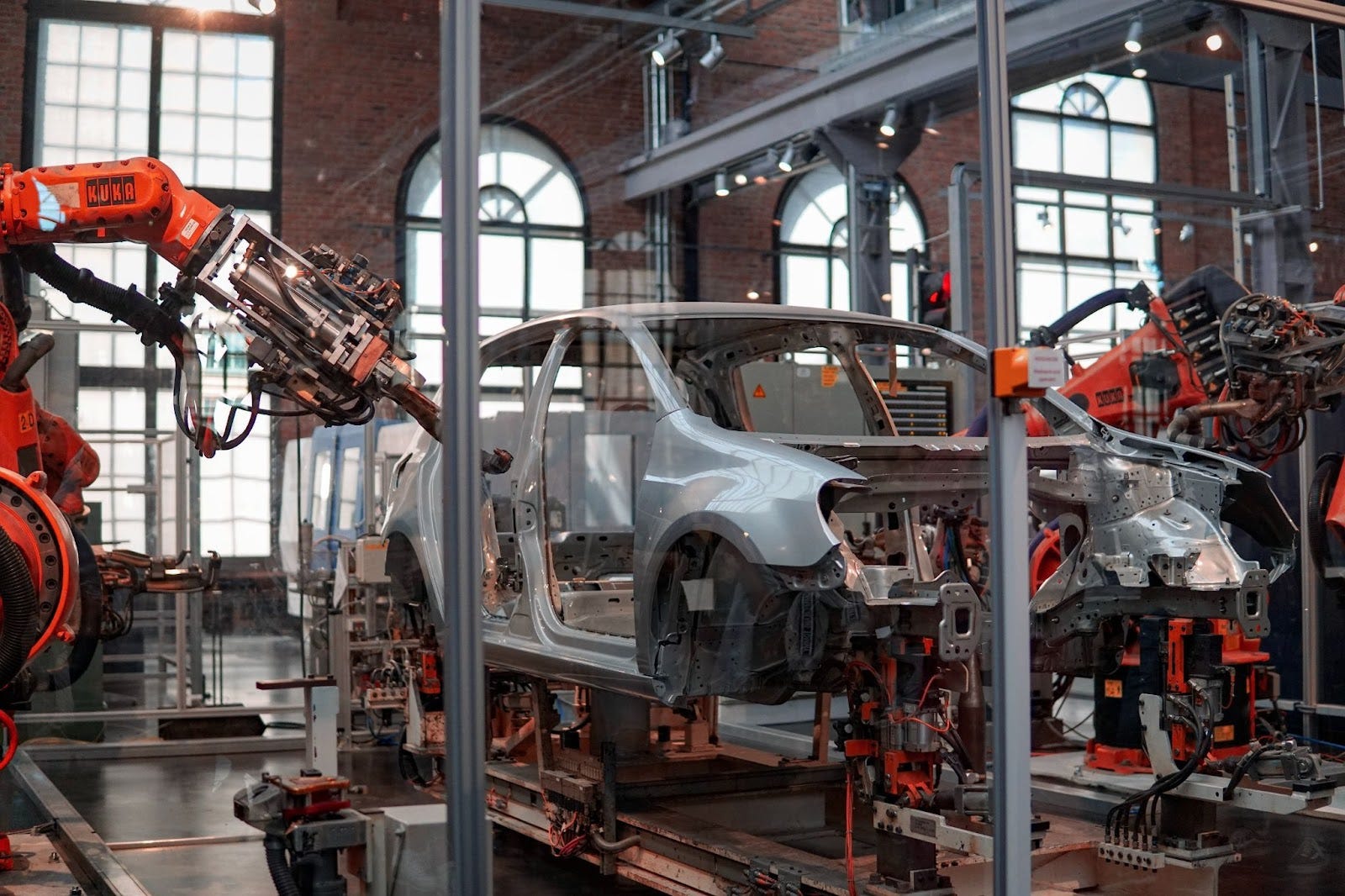car being manufactured using machines