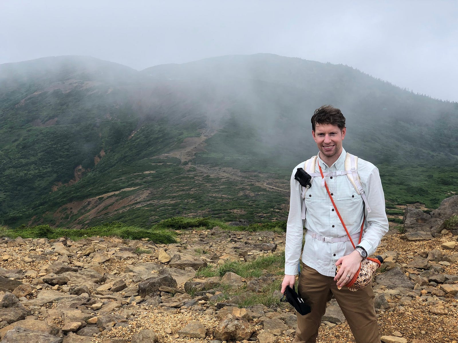 Tim Bunting AKA Kiwi Yamabushi posing on Zao-san (Mt. Zao) near Kumano-dake looking towards Jizo-dake, yet shrouded in cloud.