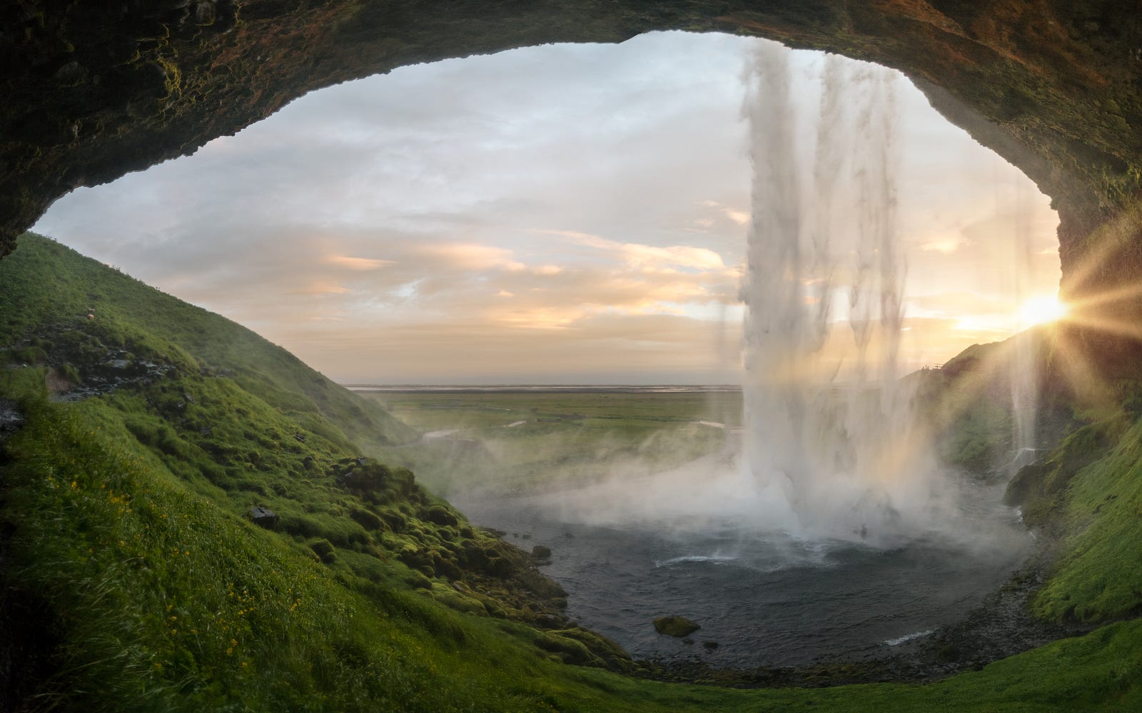 We visualize a waterfall from under an arch. Traditional approaches to healthspan enhancement have primarily revolved around well-established practices such as maintaining a nutritious diet and engaging in regular physical activity.