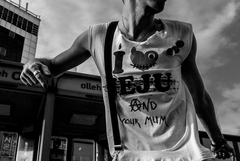 Olivier Duong 4 close up of man’s t-shirt with slogans