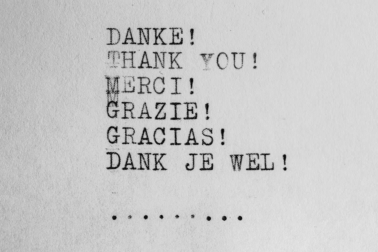 Typed letters reading thank you in various languages.