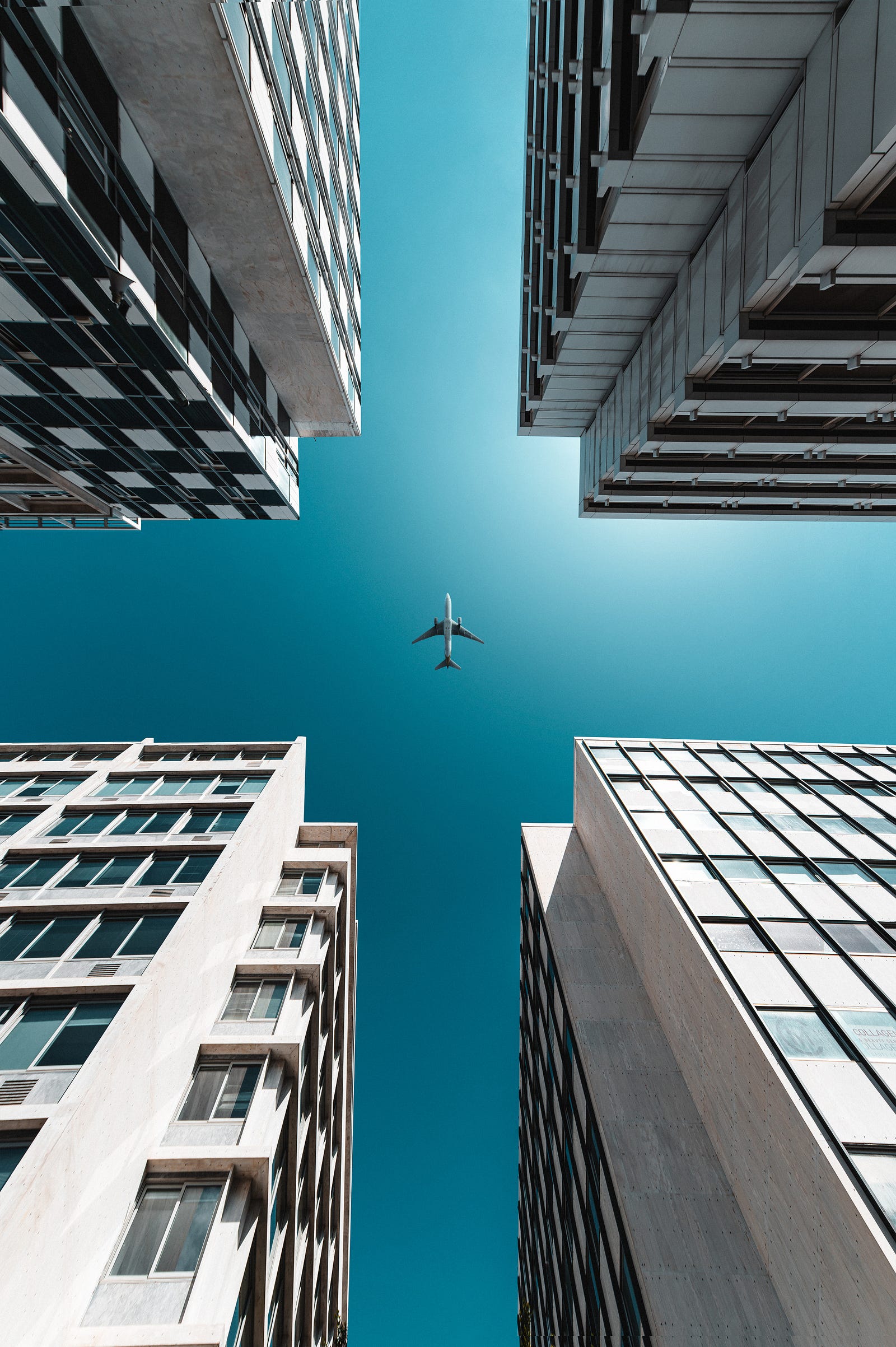 A plane flies directly over us, framed by four white buildings. Those with GAD may anticipate disaster and be overly concerned about things such as: health money family work other issues.