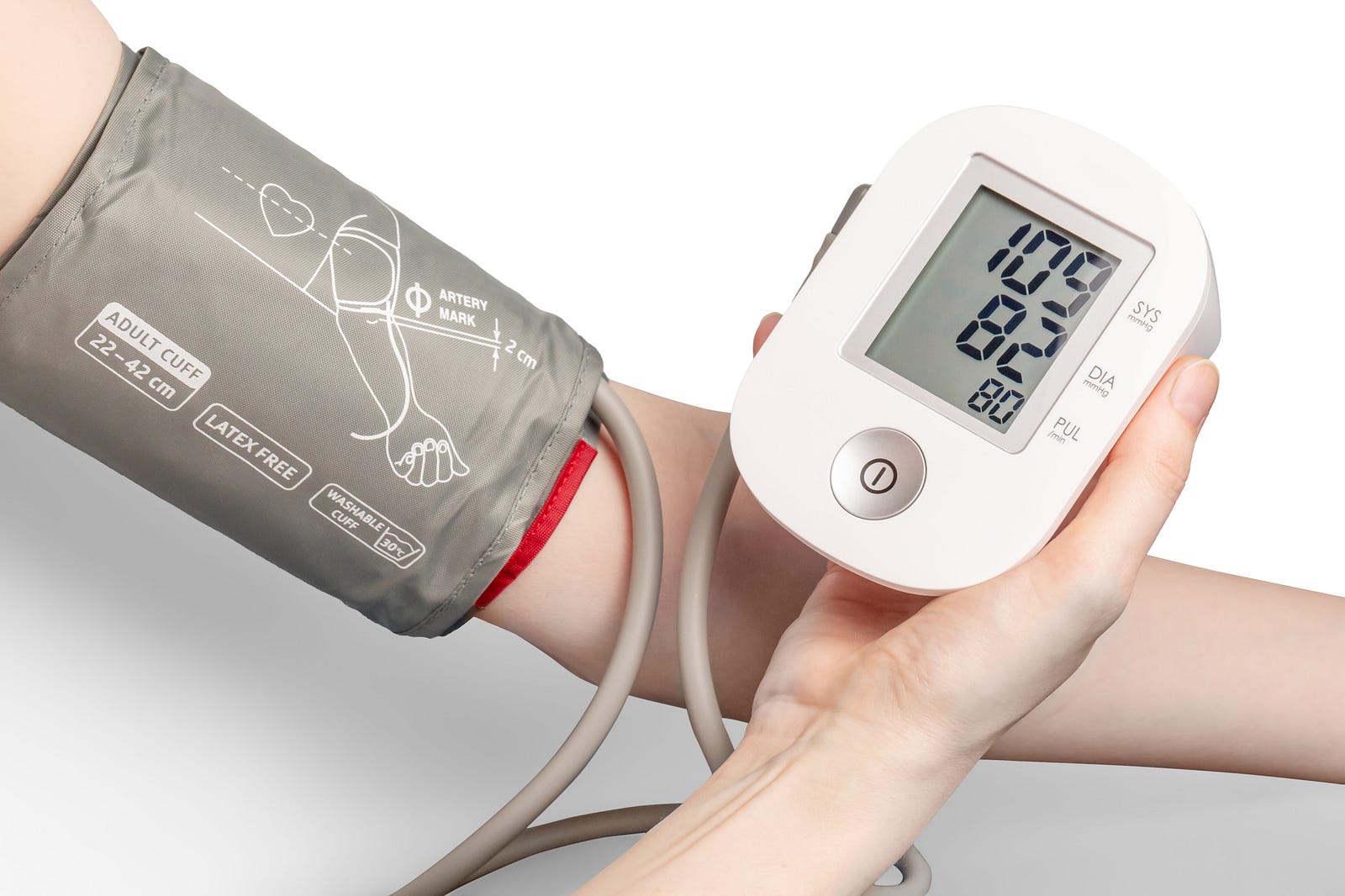 We see the arms of a person measuring their blood pressure with an automated device (on the left upper arm). The blood pressure device reads 109/82. I explore a study suggesting that as blood pressure rises above 90 mm, we risk damaging our heart’s blood vessels (coronary arteries).