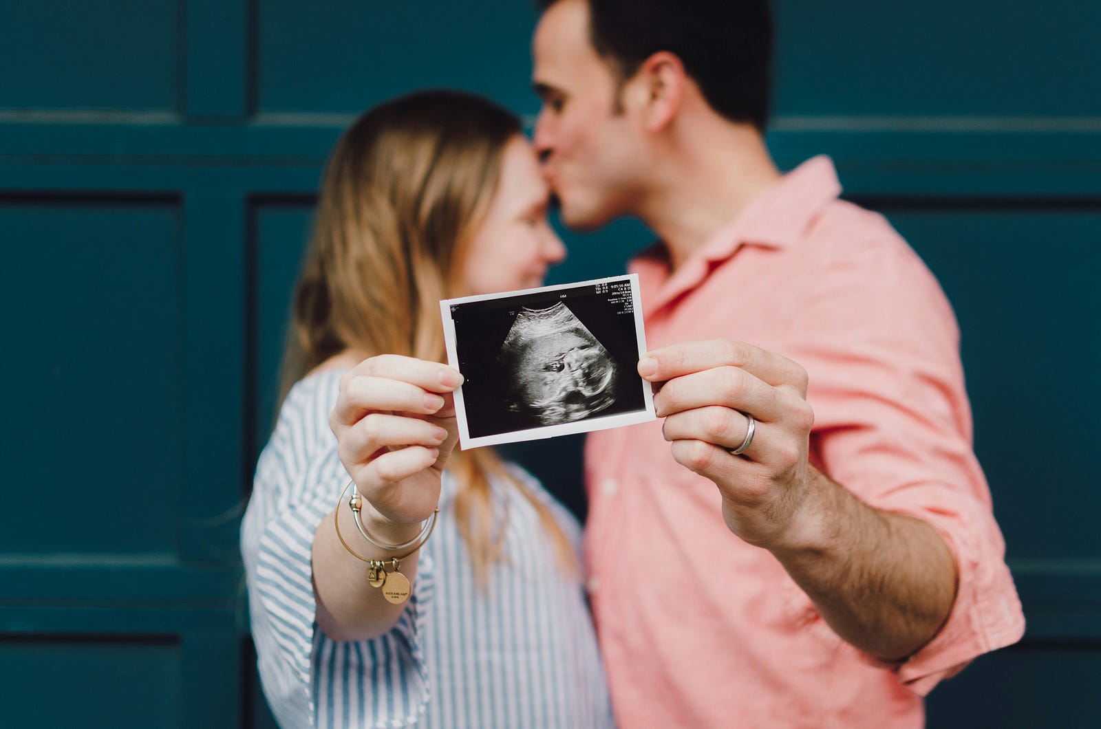 A couple faces one another as they reach out thie arms to hold a n ultrasound of a fetus. The U.S. Food and Drug Administration also advises that women who are pregnant, breastfeeding, or trying to become pregnant should speak to their doctor about safe caffeine levels.