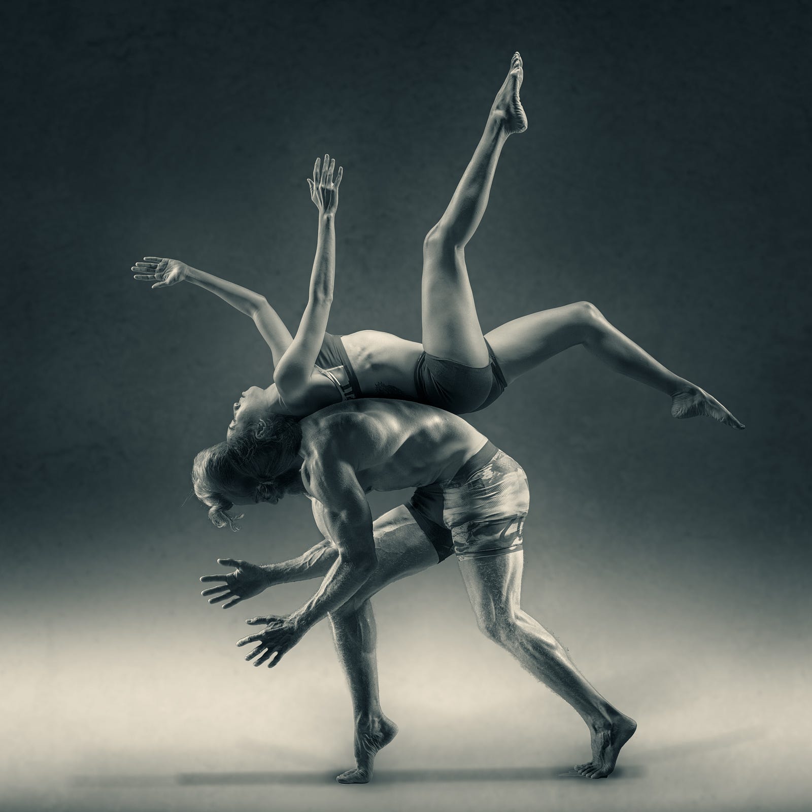 A dancer leans over as another arches, her back to his back.Vitamin D deficiency is associated with muscle loss.