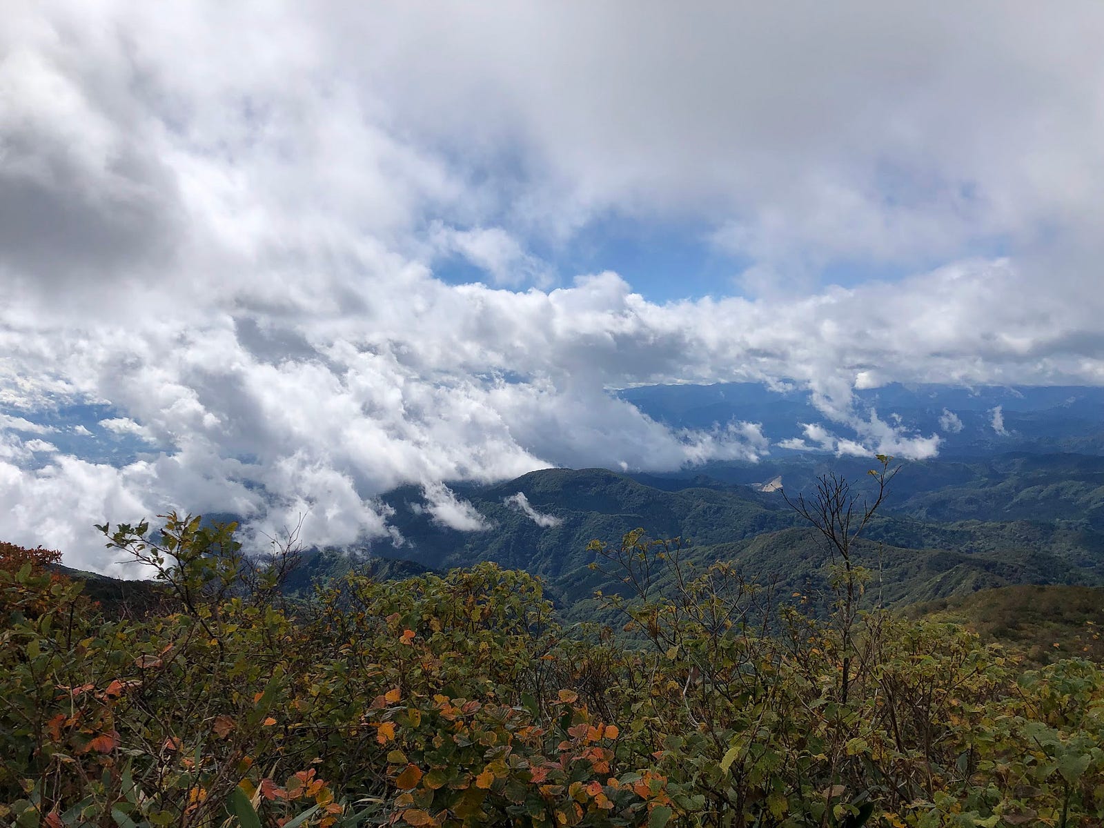 Clouds seem to emit from the mountains surrounding Murayama Ha-yama