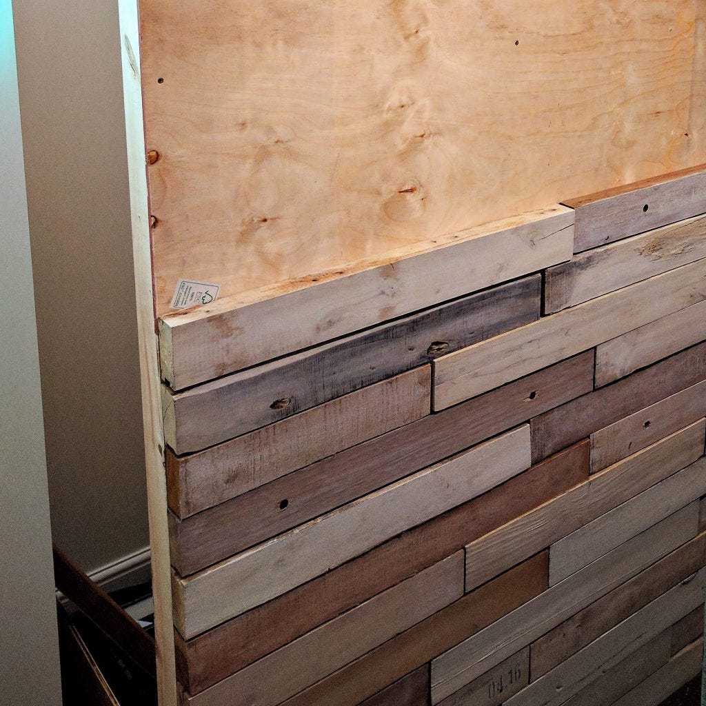 Adding reclaimed timber in a running bond pattern.